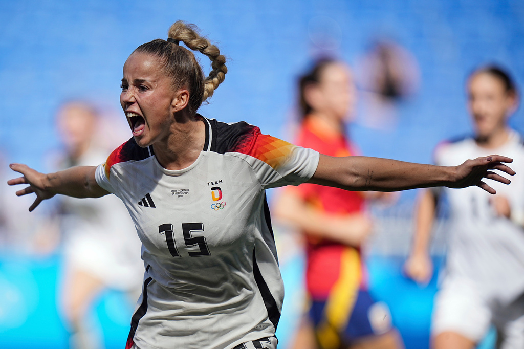 FILE - Germany's Giulia Gwinn celebrates after scoring during the women's bronze medal soccer match between Spain and Germany, at the Lyon stadium, during the 2024 Summer Olympics, Friday, Aug. 9, 2024, in Decines, France. (AP Photo/Laurent Cipriani, File)