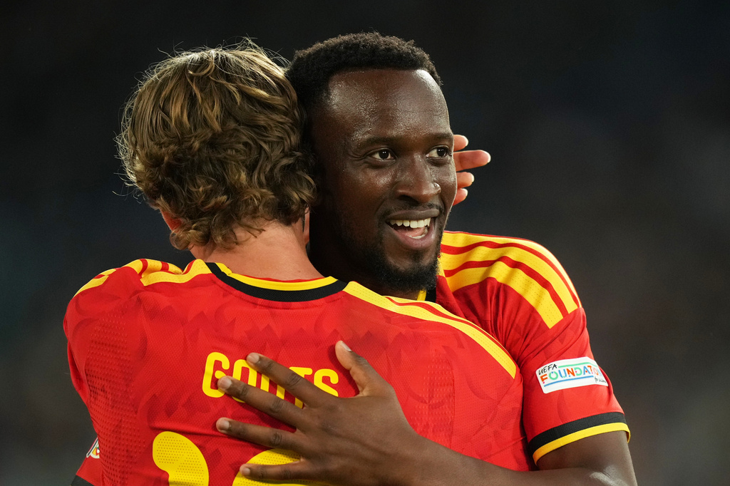 Belgium's Dodi Lukebakio celebrates with Mika Godts, left, after scoring his side's second goal during the Nations League soccer match between Italy and Belgium in Rome, Friday, Sept. 25, 2026. (AP Photo/Andrew Medichini)