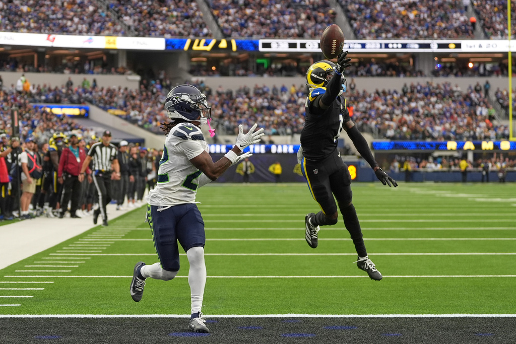 Los Angeles Rams cornerback Emmanuel Forbes, right, breaks up a pass intended for Seattle Seahawks wide receiver Rashid Shaheed during the second half of an NFL football game Sunday, Nov. 16, 2025, in Inglewood, Calif. (AP Photo/Gregory Bull)