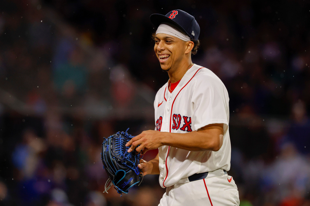 Boston Red Sox pitcher Jedixson Paez smiles after walking off the mound during the seventh inning of the second baseball game of a doubleheader against the Chicago Cubs, Friday, Sept. 25, 2026, in Boston. (AP Photo/Greg M. Cooper)