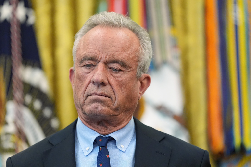FILE - Health and Human Services Secretary Robert F. Kennedy Jr., listens during a meeting to sign an executive order about vaccines Aug. 10, 2026, in the Oval Office of the White House in Washington. (AP Photo/Jacquelyn Martin, File)