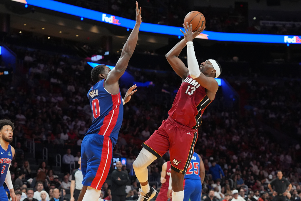Miami Heat center Bam Adebayo (13) aims to score as Detroit Pistons center Jalen Duren (0) defends during the second half of an NBA basketball game Sunday, March 8, 2026, in Miami. (AP Photo/Marta Lavandier)