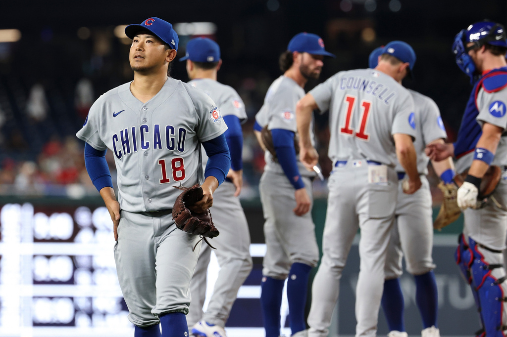 Chicago Cubs pitcher Shota Imanaga (18) walks off the field after being removed from the game by manager Craig Counsell (11) during the fifth inning of a baseball game, Tuesday, Aug 11, 2026, in Washington. (AP Photo/Terrance Williams)