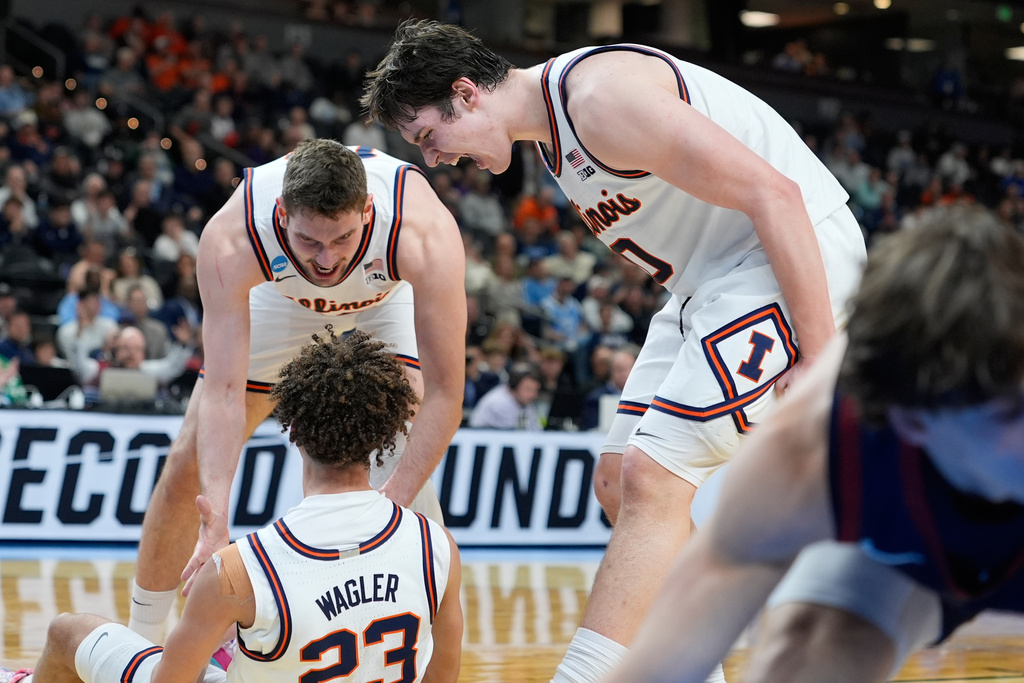 Illinois forward David Mirkovic (0) celebrates with Illinois guard Keaton Wagler (23) during the second half in the first round of the NCAA college basketball tournament against Pennsylvania, Thursday, March 19, 2026, in Greenville, S.C. (AP Photo/Brynn Anderson)