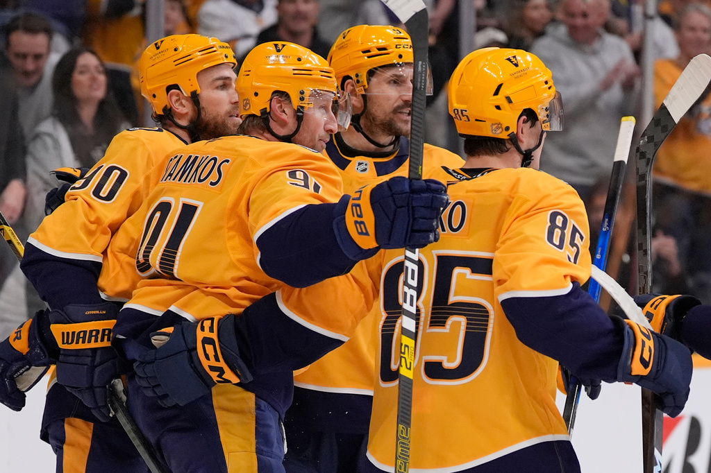 Nashville Predators center Steven Stamkos (91) celebrates his goal with teammates during the second period of an NHL hockey game against the Anaheim Ducks, Thursday, April 16, 2026, in Nashville, Tenn. (AP Photo/George Walker IV)