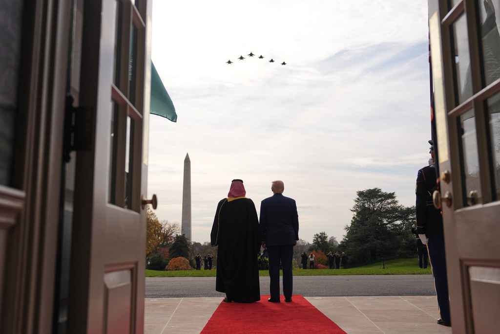 President Donald Trump and Saudi Arabia's Crown Prince Mohammed bin Salman watch a flight of F-35's and F-15's during a welcome ceremony on the South Lawn of the White House, Tuesday, Nov. 18, 2025, in Washington. (AP Photo/Evan Vucci)