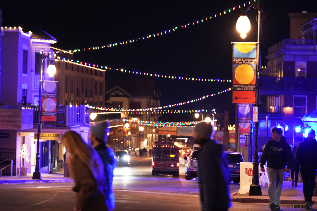 Pedestrians pass down Main Street before the start of the 2026 Sundance Film Festival on Wednesday, Jan. 21, 2026, in Park City, Utah. (AP Photo/Chris Pizzello)