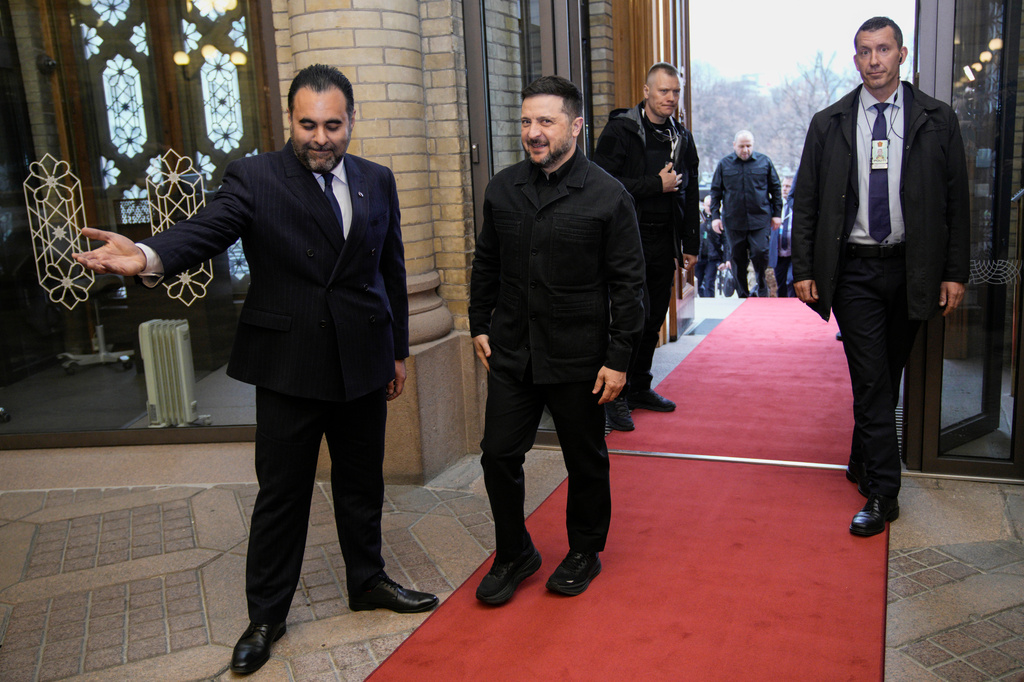 Ukrainian President Volodymyr Zelenskyy is welcomed by the President of the Norwegian Parliament Masud Gharahkhani, left, during his visit to Norway on Wednesday April 15, 2026. (Stian Lysberg Solum/NTB via AP)