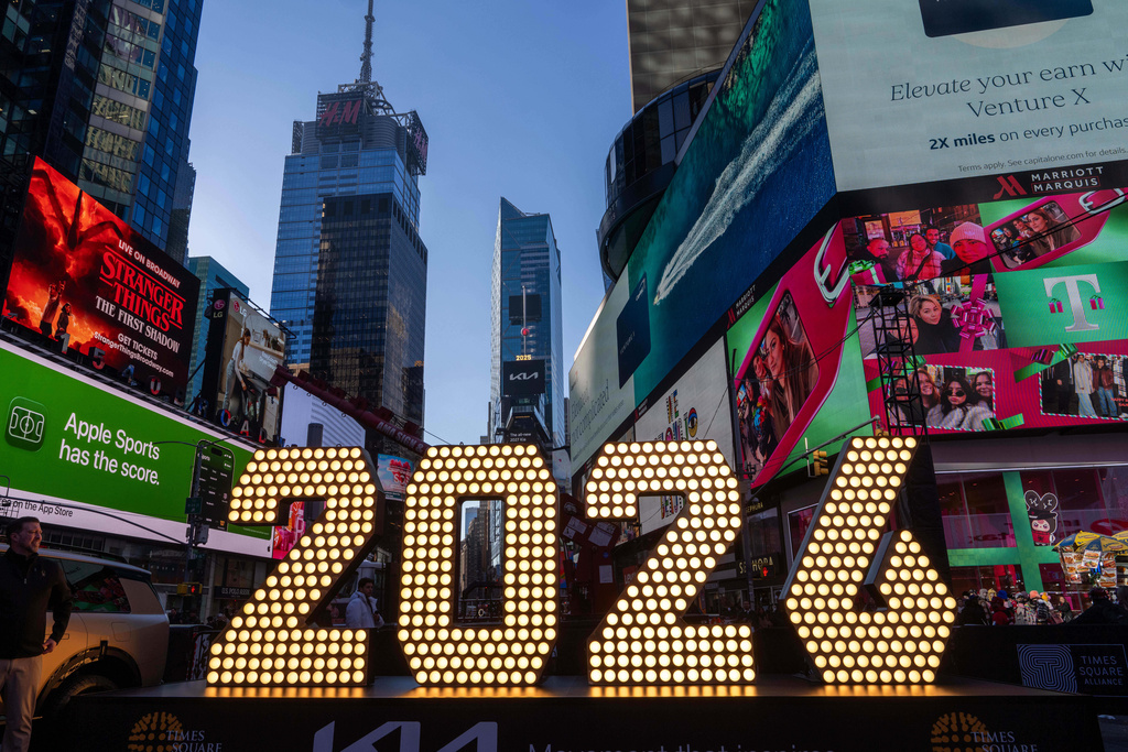 FILE - The 7-foot tall "2026" numerals are displayed at an illumination ceremony in Times Square, Thursday, Dec. 18, 2025, in New York. (AP Photo/Adam Gray, File)