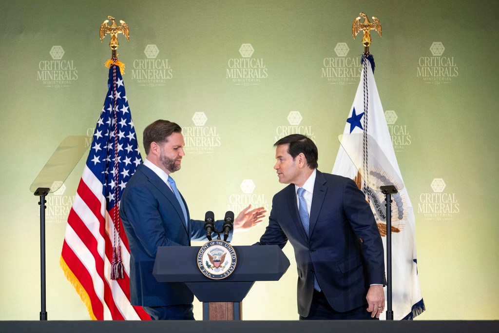 Secretary of State Marco Rubio, right, welcomes Vice President JD Vance to the stage during the Critical Minerals Ministerial meeting at the State Department, Wednesday, Feb. 4, 2026 in Washington. (AP Photo/Kevin Wolf)