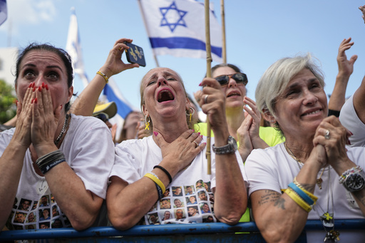 People react as they gather to watch a live broadcast of Israeli hostages released from Gaza at a plaza known as hostages square in Tel Aviv, Israel, Monday, Oct. 13, 2025. (AP Photo/Oded Balilty) People react as they gather to watch a live broadcast of Israeli hostages released from Gaza at a plaza known as hostages square in Tel Aviv, Israel, Monday, Oct. 13, 2025. (AP Photo/Oded Balilty)