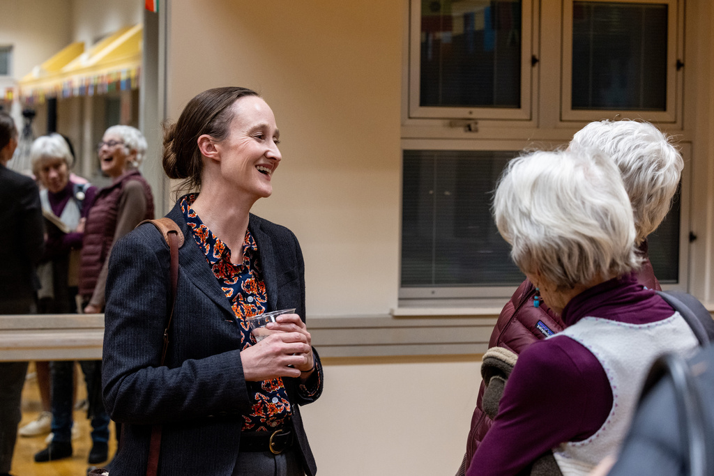 Seattle mayoral candidate Katie Wilson speaks with attendees after a climate forum Thursday, Oct. 16, 2025, in Seattle. (AP Photo/Maddy Grassy)