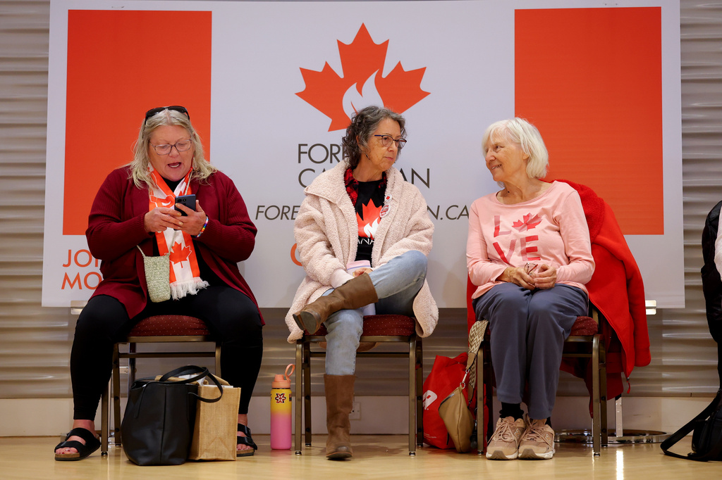 Supporters wait for results at the pro-Canada watch party in Edmonton, Alberta Monday, Oct. 19, 2026. (James Maclennan/The Canadian Press via AP)
