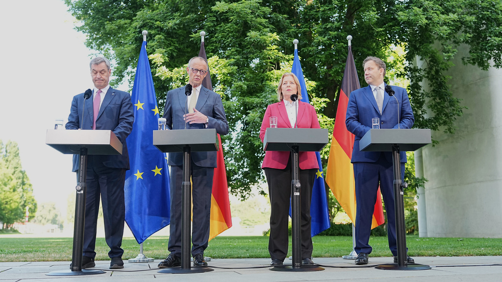 From left, Minister-President of Bavaria and CSU Chairman Markus Söder, German Federal Chancellor Friedrich Merz, Federal Minister of Labor and Social Affairs Bärbel Bas and Federal Minister of Finance, Lars Klingbeil hold a press conference in the garden of the Chancellery following the meeting of the coalition committee, in Berlin, Thursday, July 2, 2026. (Michael Kappeler/dpa via AP)