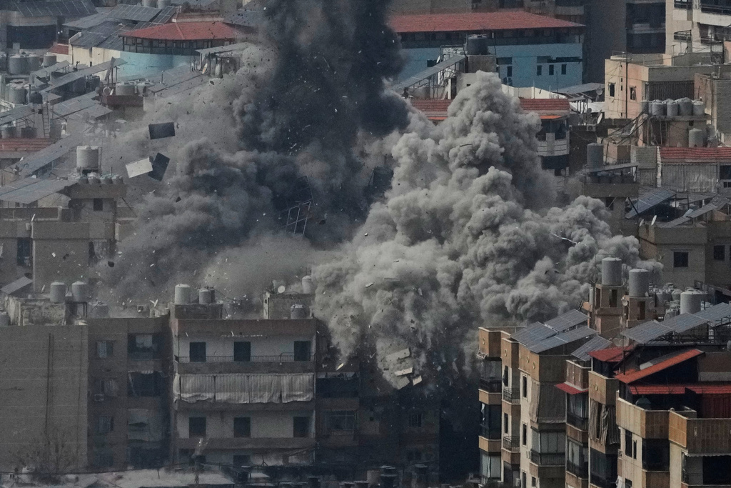 Smoke rises following an Israeli airstrike in Dahiyeh, Beirut's southern suburbs, Friday, March 6, 2026. (AP Photo/Hussein Malla)
