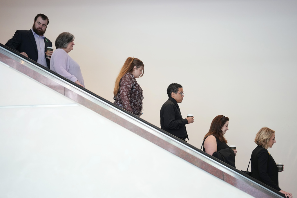Members of the Hortman family come down the escalator into the lobby of the Diana E. Murphy United States Courthouse before a sentencing hearing for Vance Boelter in Minneapolis, on Thursday, July 23, 2026. (Alex Kormann/Minnesota Star Tribune via AP)