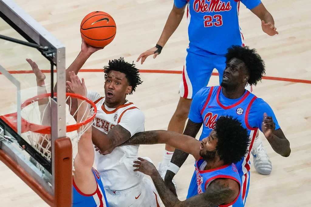Texas forward Dailyn Swain (3) puts the ball up to score during the first half of an during an NCAA college basketball game against Mississippi, Saturday, Feb. 7, 2026, in Austin, Texas. (Sara Diggins/Austin American-Statesman via AP)