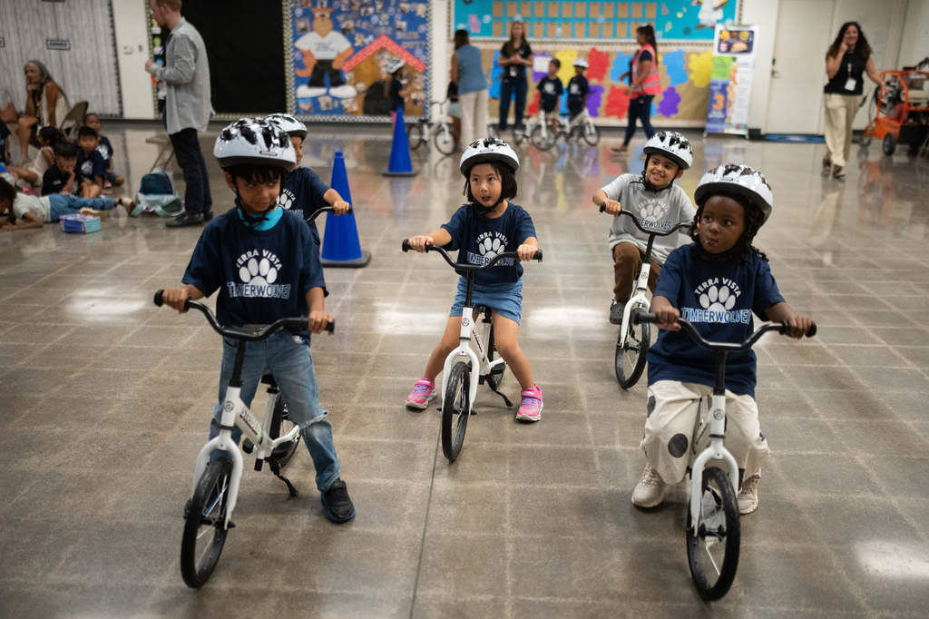 Students participate in a learn-to-ride program at Terra Vista Elementary School in Rancho Cucamonga, Calif., Wednesday, Sept. 2, 2026.(AP Photo/Jae C. Hong)