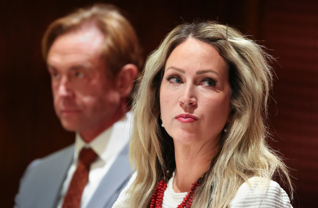 Laura Ah Loo, widow of Arthur Folasa Ah Loo, listens during a press conference about the Salt Lake County District Attorney's announcement that manslaughter charges have been filed against Matt Alder for the fatal shooting of Ah Loo, who was an innocent bystander at a "No Kings" rally, in Salt Lake City, Wednesday, Dec. 3, 2025. (Kristin Murphy/The Deseret News via AP)