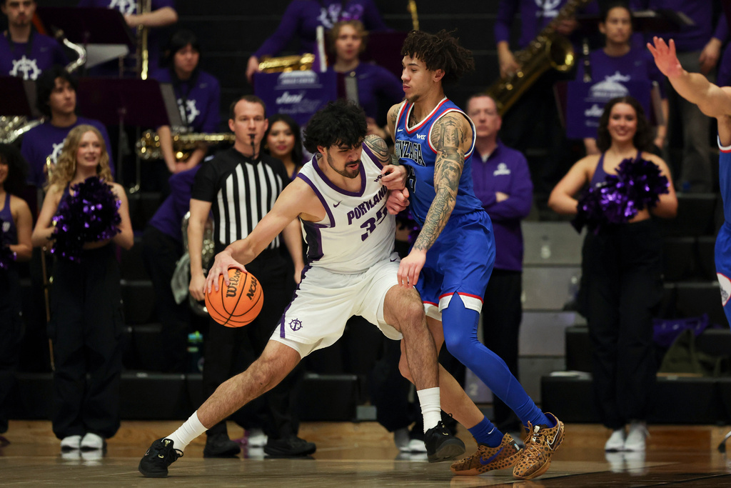 Portland forward Cameron Williams (35) drives to the basket as Gonzaga guard Jalen Warley (8) defends during the first half of an NCAA college basketball game in Portland, Ore., Wednesday, Feb. 4, 2026. (AP Photo/Amanda Loman)