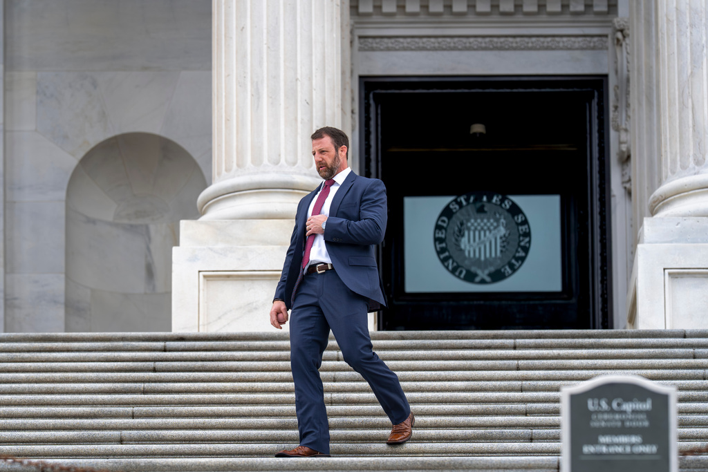 Sen. Markwayne Mullin, R-Okla., arrives to speak with reporters on the steps at the Capitol in Washington, Thursday, March 5, 2026. (AP Photo/J. Scott Applewhite)