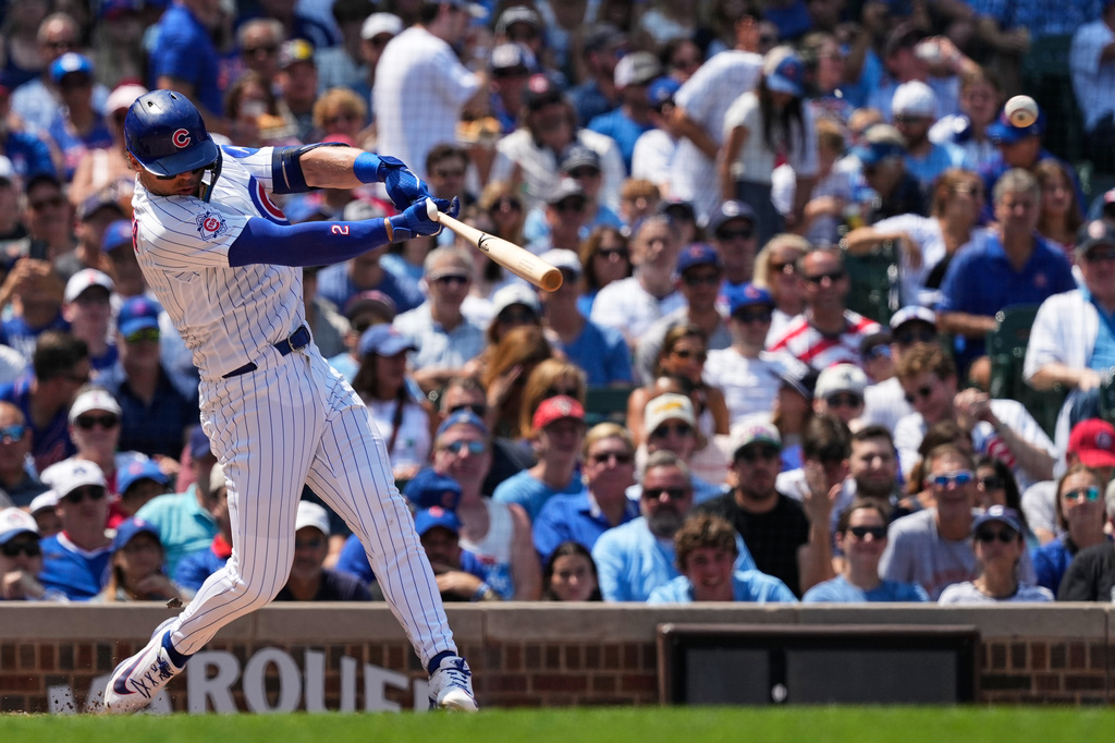 Chicago Cubs' Nico Hoerner hits a three-run triple during the third inning of a baseball game against the Minnesota Twins in Chicago, Sunday, July 19, 2026. (AP Photo/Nam Y. Huh)