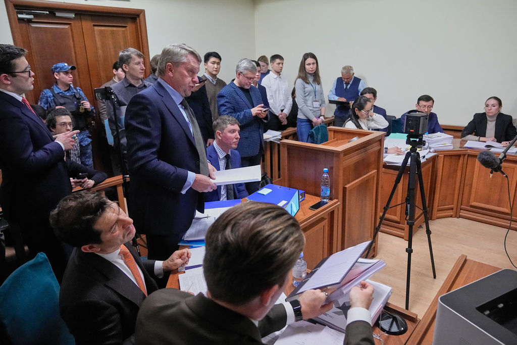 Participants gather in Moscow's Arbitration Court to hold a hearing to consider a lawsuit by Russia's Central Bank against the Euroclear Group in Moscow, Russia, Friday, Jan. 16, 2026. (AP Photo/Pavel Bednyakov)