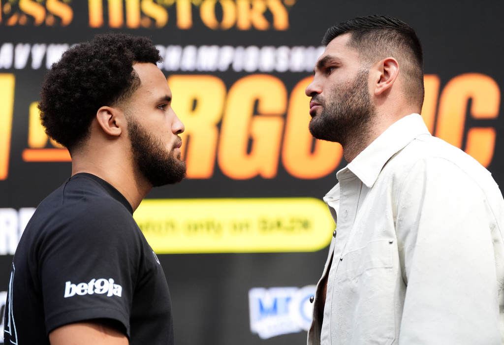 Boxers Filip Hrgovic, right, and Moses Itauma pose following a press conference, Thursday Aug. 27, 2026, in London, ahead of the IBF heavyweight championship bout. (Adam Davy/PA via AP)