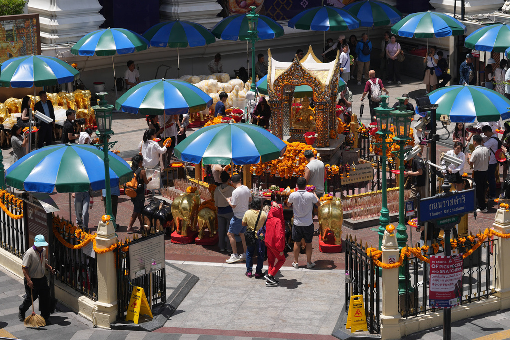 Visitors pray at the Erawan Shrine in Bangkok, Thailand, Wednesday, June 10, 2026. (AP Photo/Sakchai Lalit)