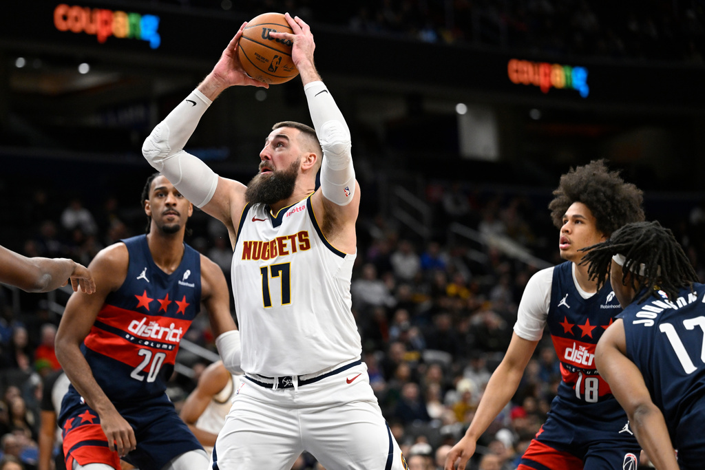 Denver Nuggets center Jonas Valanciunas (17) looks to shoot during the first half of an NBA basketball game against the Washington Wizards, Thursday, Jan. 22, 2026, in Washington. (AP Photo/John McDonnell)