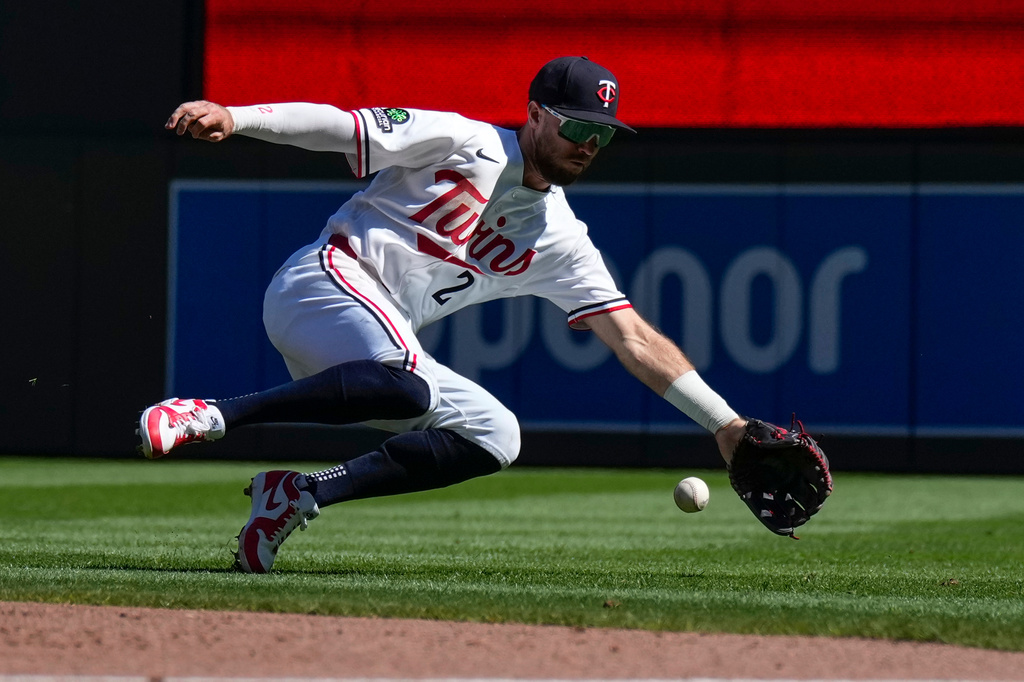 Minnesota Twins second baseman Kody Clemens fields a single hit by Cleveland Guardians' Steven Kwan during the second inning of a baseball game Sunday, Sept. 13, 2026, in Minneapolis. (AP Photo/Joseph Scheller)