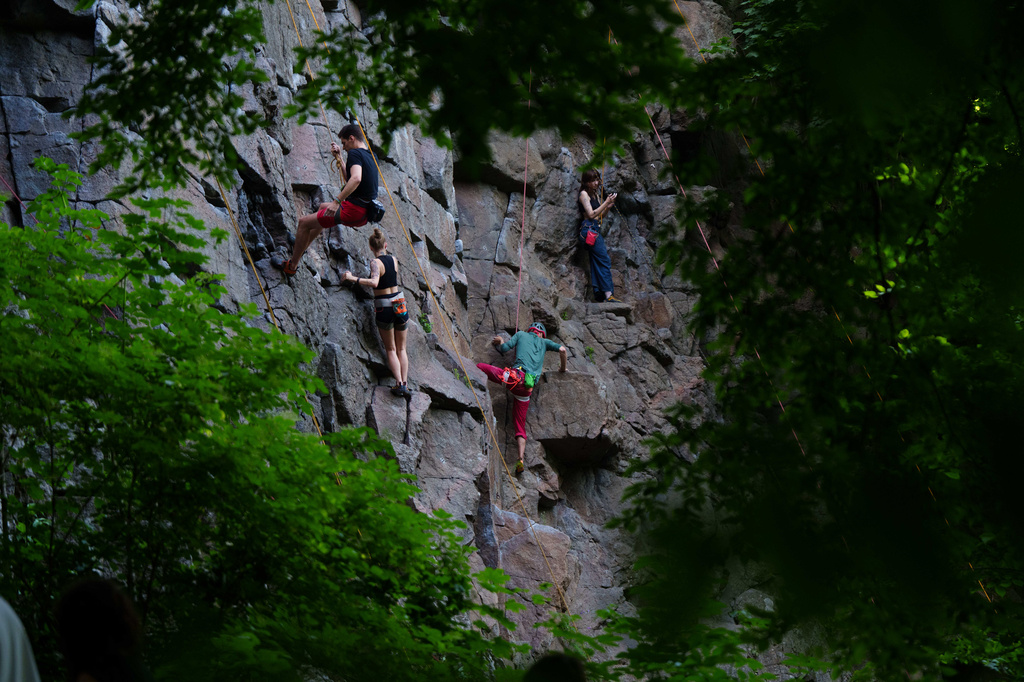 People climb on a cliff during the Stoned Climbers festival near Denyshi, Zhytomyr region, Ukraine, Saturday, June 27, 2026. (AP Photo/Evgeniy Maloletka)
