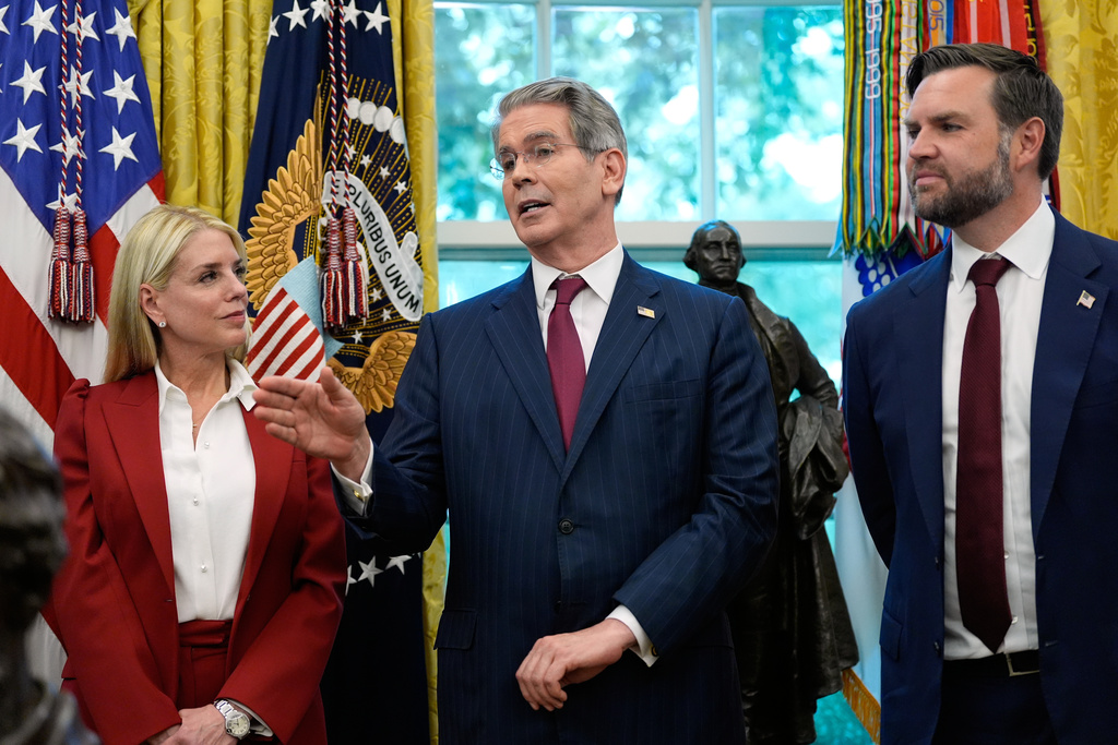 Treasury Secretary Scott Bessent speaks after President Donald Trump signed an executive order regarding TikTok in the Oval Office at the White House, Thursday, Sept. 25, 2025, in Washington, as Attorney General Pam Bondi and Vice President JD Vance listen. (AP Photo/Alex Brandon)