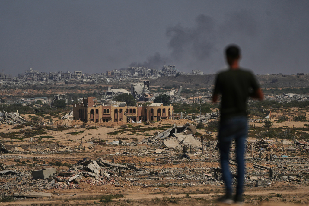Smoke rises following an Israeli military strike in Gaza City as seen from the central Gaza Strip, Wednesday, Oct. 8, 2025. (AP Photo/Abdel Kareem Hana)
