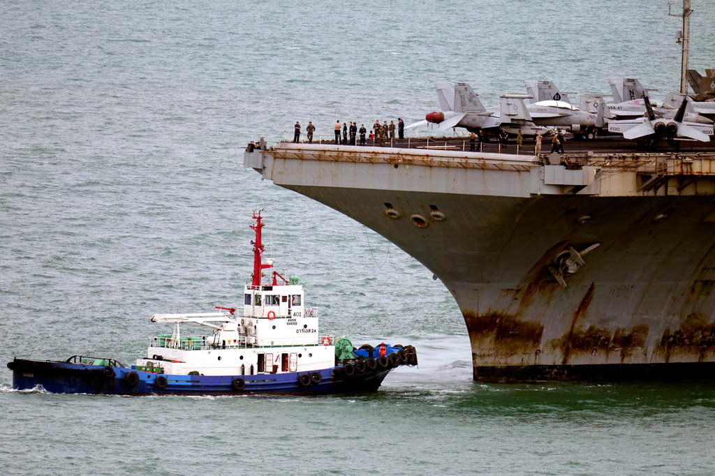 A tug boat greets the U.S. Navy aircraft carrier USS Abraham Lincoln as it arrives at the port in Laem Chabang, Chonburi, Thailand, Wednesday, Sept. 2, 2026. (AP Photo/Sakchai Lalit)