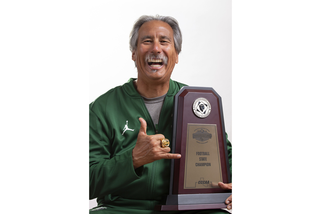 This photo provided by Peralta Community College District shows Laney College Athletic Director John Beam after Laney won the California state football championship in 2018. (Peralta Community College District via AP)