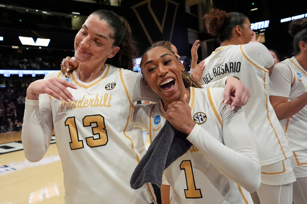 Vanderbilt guards Justine Pissott (13) and Mikayla Blakes (1) celebrate the team's win in the first round of the NCAA college basketball tournament against the High Point, Saturday, March 21, 2026, in Nashville, Tenn. (AP Photo/George Walker IV)
