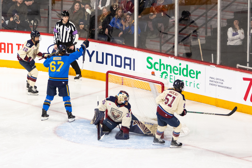 Toronto Sceptres' Emma Woods (67) celebrates a goal against Montreal Victoire goaltender Ann-Renee Desbiens (35) scores a goal during the first period of a PWHL Takeover Tour game in Halifax, on Wednesday, Dec. 17, 2025. (Riley Smith/The Canadian Press via AP)