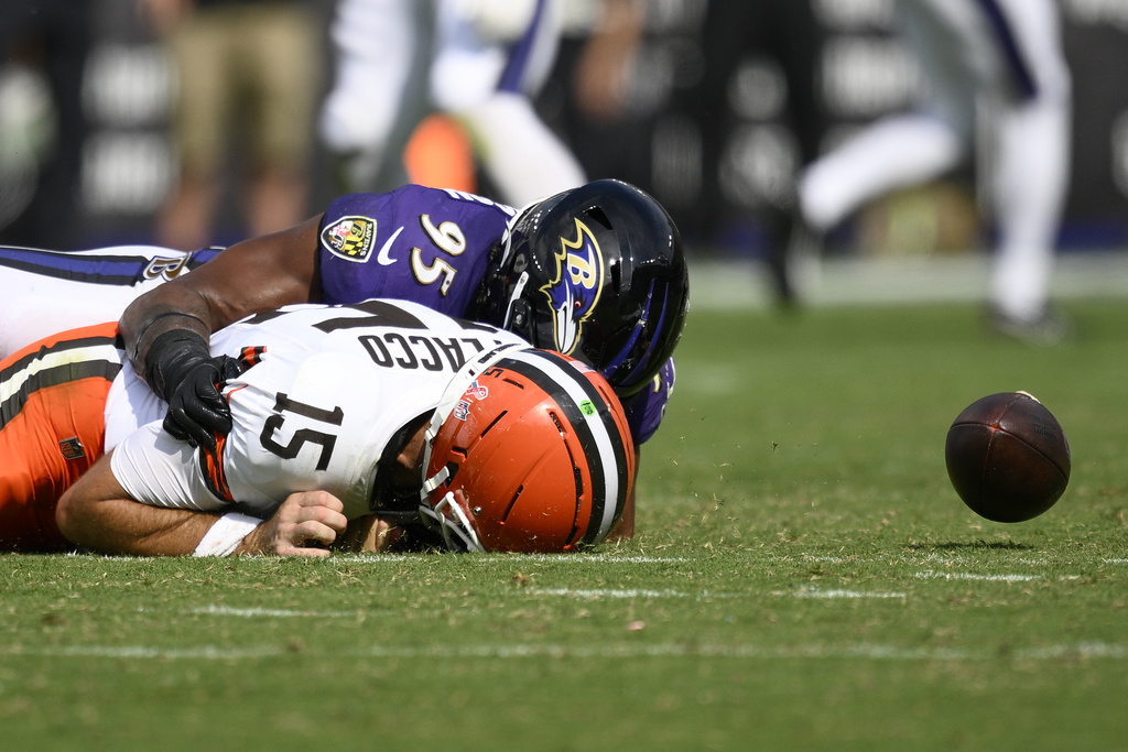 Baltimore Ravens linebacker Tavius Robinson sacks Cleveland Browns quarterback Joe Flacco forcing a fumble during the second half of an NFL football game, Sunday, Sept. 14, 2025, in Baltimore. (AP Photo/Nick Wass)