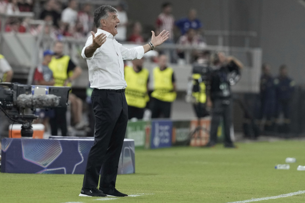 Olympiacos' head coach Jose Luis Mendilibar reacts during a Champions League opening phase soccer match between Olympiakos and Pafos at the Georgios Karaiskakis stadium, Piraeus port, near Athens, Greece, Wednesday, Sept. 17, 2025. (AP Photo/Petros Giannakouris)