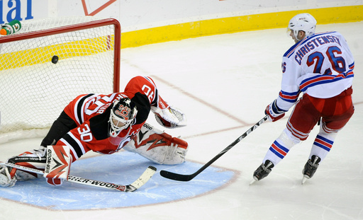 FILE - New York Rangers' Erik Christensen, right, scores a goal against New Jersey Devils goaltender Martin Brodeur during the shootout of an NHL hockey game March 25, 2010 in Newark, N.J. (AP Photo/Bill Kostroun, File) FILE - New York Rangers' Erik Christensen, right, scores a goal against New Jersey Devils goaltender Martin Brodeur during the shootout of an NHL hockey game March 25, 2010 in Newark, N.J. (AP Photo/Bill Kostroun, File)