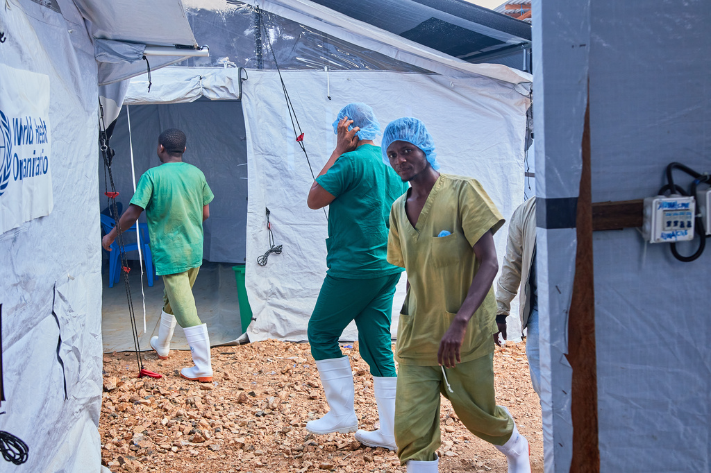 Health workers walk, at the Evangelical Medical Center, in Bunia, eastern Congo, Friday, July 3, 2026, where Ebola clinical trials are scheduled to take place. (AP Photo/Dirole Lotsima Dieudonne)