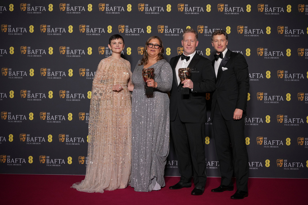 Ginnifer Goodwin, from left, Yvett Merino, Jared Bush, and Josh Dallas pose with the award for animated film for 'Zootopia 2'at the 79th British Academy Film Awards, BAFTA's, in London, Sunday, Feb. 22, 2026. (AP Photo/Alastair Grant)