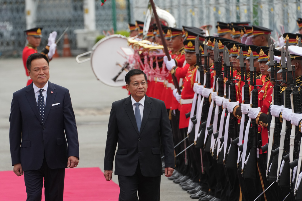 Thailand's Prime Minister Anutin Charnvirakul, left, and Myanmar's President Min Aung Hlaing review an honor guard during a welcome ceremony at the Government House in Bangkok, Thailand Thursday, Aug. 6, 2026. (AP Photo/Sakchai Lalit)