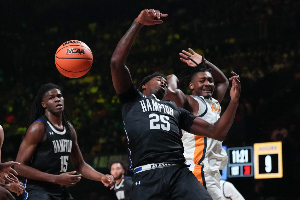 Hampton forward Xzavier Long (25) misses a rebound against North Carolina A&T center Will Felton during the first half of an HBCU Classic NCAA college basketball game Friday, Feb. 13, 2026, in Inglewood, Calif. (AP Photo/Jae C. Hong)