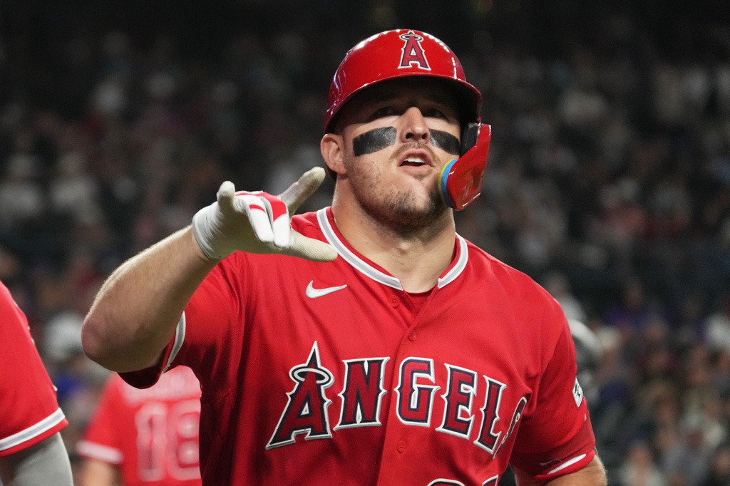 Los Angeles Angels' Mike Trout (27) reacts after hitting a two-run home run against the Arizona Diamondbacks in the fifth inning of a baseball game, Tuesday, June 16, 2026, in Phoenix. (AP Photo/Rick Scuteri)