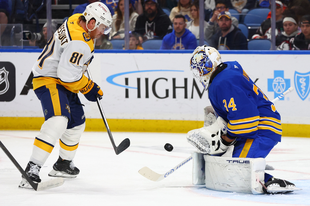 Nashville Predators center Jonathan Marchessault (81) is stopped by Buffalo Sabres goaltender Alex Lyon (34) during the second period of an NHL hockey game Saturday, March 7, 2026, in Buffalo, N.Y. (AP Photo/Jeffrey T. Barnes)