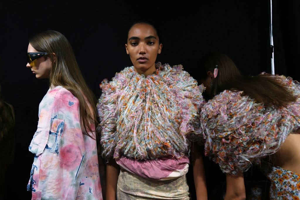 Models wear creations part of the Diesel's Spring Summer 2026 collection in the backstage ahead of the collection's show, in Milan, Italy, Tuesday, Sept. 23, 2025. (AP Photo/Antonio Calanni)
