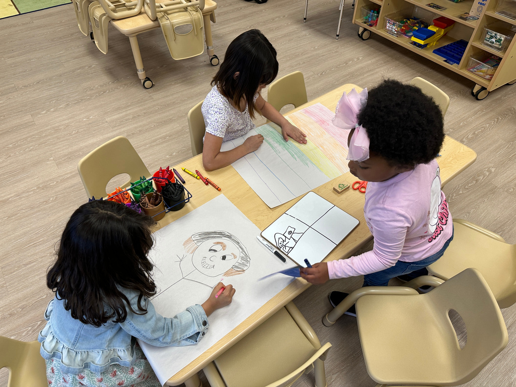 FILE - Children draw in one of the classrooms at the Children's Promise Centers child care center in Albuquerque, N.M., April 5, 2024. (AP Photo/Susan Montoya Bryan, File)