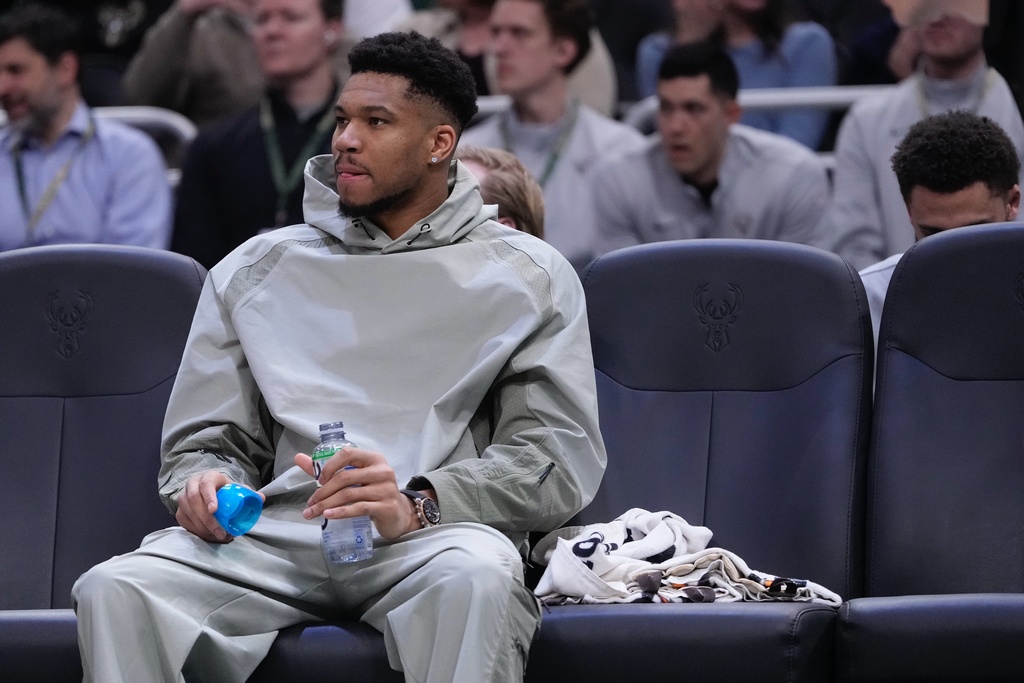 Milwaukee Bucks' Giannis Antetokounmpo watches from the bench during the first half of an NBA basketball game Tuesday, Feb. 3, 2026, in Milwaukee. (AP Photo/Morry Gash)